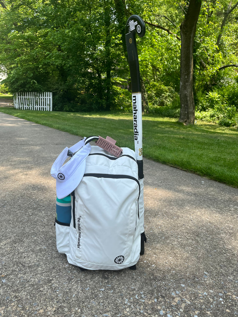 White Indian Maharadja sports backpack that holds field hockey stick!